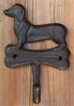 Kapstokhaak Teckel met kluif, hond, gietijzer KH1726