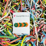 Groen/oranje madeliefjes op alligatorclip - carnaval (groot) - haaraccessoires
