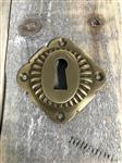 Rozet in gepatineerde messing, vergrendelen wapenschild voor binnendeuren