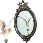 Ovale spiegel in zwart met zilver bekroond door cupido met pijlen en toorts (No.362705)