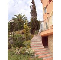 a large Spanish villa with entrance to the beach.