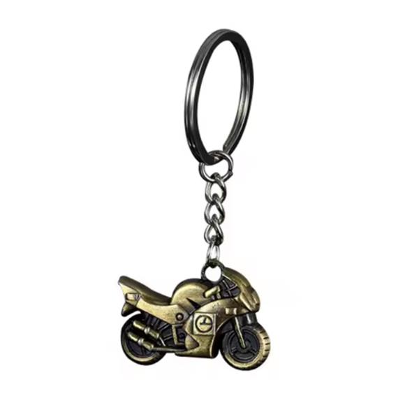 Grote foto sleutelhanger gouden buikschuiver motoren kleding