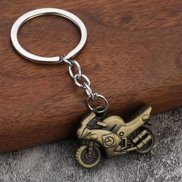 Grote foto sleutelhanger gouden buikschuiver motoren kleding