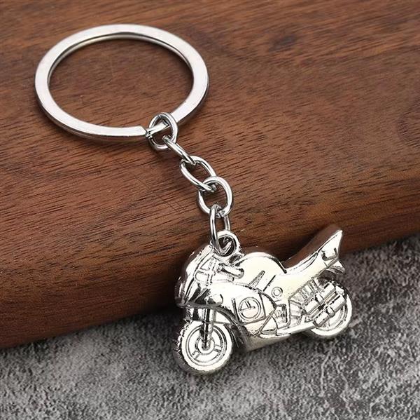 Grote foto sleutelhanger zilveren buikschuiver motoren kleding