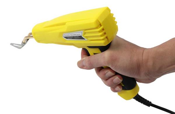 Grote foto kunststof plastic laspistool geel auto onderdelen auto gereedschap