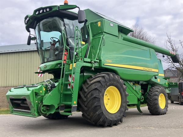 Grote foto john deere t560 agrarisch maaidorsers