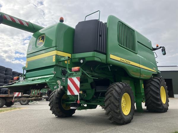 Grote foto john deere t560 agrarisch maaidorsers