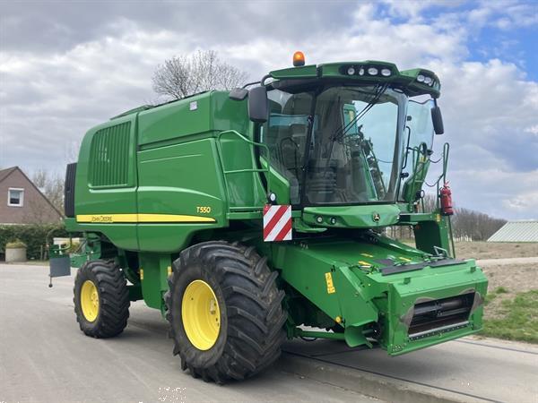 Grote foto john deere t560 agrarisch maaidorsers