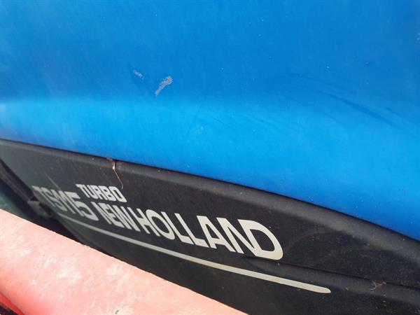Grote foto new holland ts 115 met frontlader agrarisch tractoren