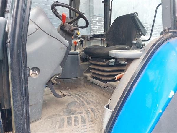 Grote foto new holland ts 115 met frontlader agrarisch tractoren