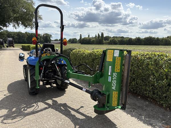Grote foto new holland boomer 25 met klepelmaaier agrarisch tractoren