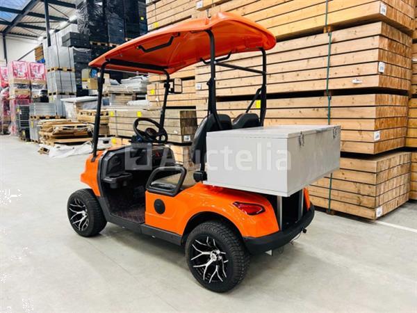 Grote foto rte golfkar met opslagbox oranje doe het zelf en verbouw hefwerktuigen