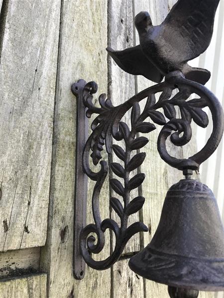 Grote foto een sierlijke deurbel met een vogel erop gemaakt van gietijzer doe het zelf en verbouw materialen en producten