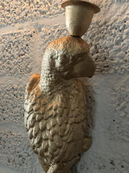 Grote foto set gietijzeren papegaaien gold kleur als wand kandelaars mooi en apart tuin en terras tuindecoratie