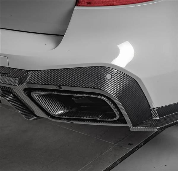 Grote foto dit betreft een set bmw x5 g05 carbon uitlaat sier stukken tips auto onderdelen tuning en styling