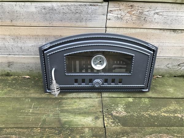 Grote foto ovendeur voor de kachel of oven met een temperatuur meter en een hittebestendig handvat gemaakt van huis en inrichting kachels en openhaarden