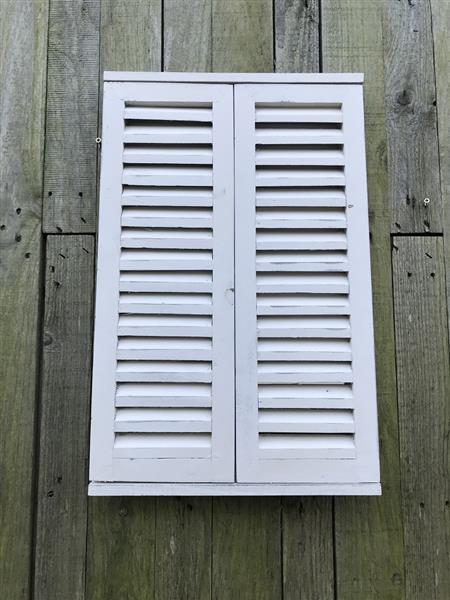 Grote foto een spiegel met openslaande deuren gemaakt van hout huis en inrichting overige