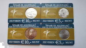 Grote foto de eerste 4 coincards uitgegeven door de knm postzegels en munten nederland