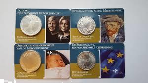 Grote foto de eerste 4 coincards uitgegeven door de knm postzegels en munten nederland