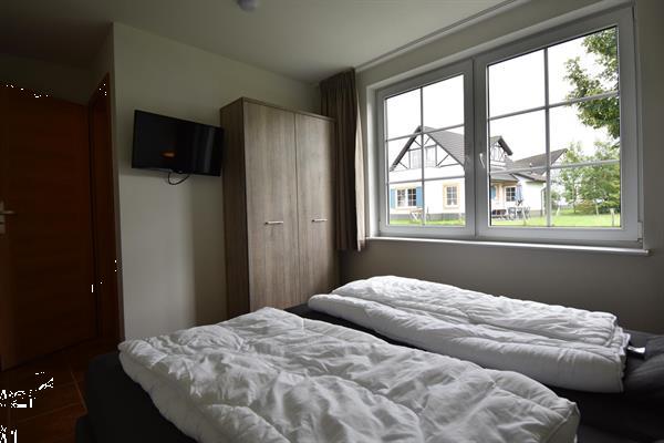 Grote foto vakantiehuis te koop aan een golfbaan. huizen en kamers vrijstaand