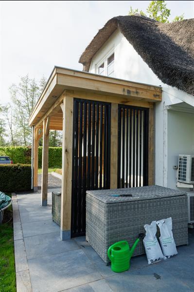 Grote foto houten tuinkamer tuin en terras veranda en overkappingen