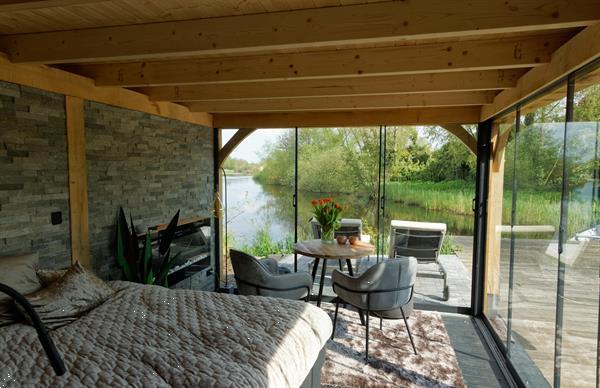 Grote foto houten tuinkamer tuin en terras veranda en overkappingen