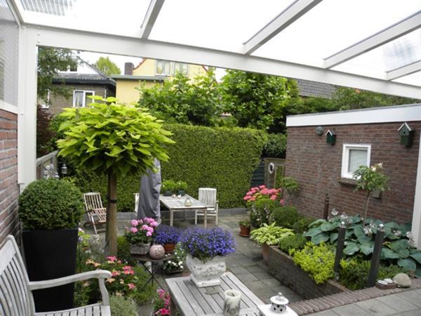 Grote foto greenline veranda 500x400cm polycarbonaat dak tuin en terras tegels en terrasdelen