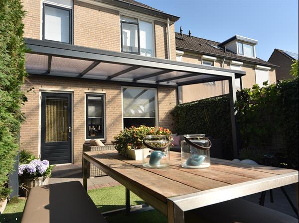 Grote foto greenline veranda 500x400cm polycarbonaat dak tuin en terras tegels en terrasdelen