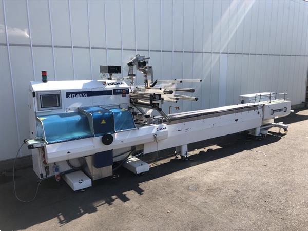 Grote foto ulma atlanta high tech flowpackmachine met dakota invoerband agrarisch tuinbouw