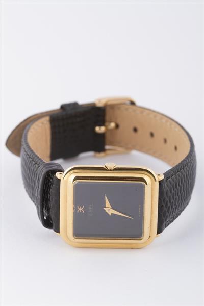 Grote foto gouden ebel horloge aan lederen band kleding dames horloges