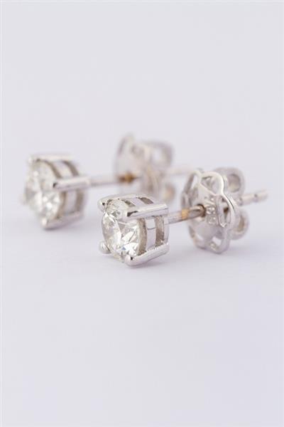 Grote foto wit gouden solitair oorknoppen met in elk een briljant. totaal ca. 0.80 ct. sieraden tassen en uiterlijk oorbellen
