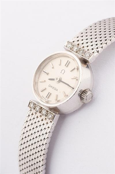 Grote foto wit gouden horloge van het merk omega kleding dames horloges