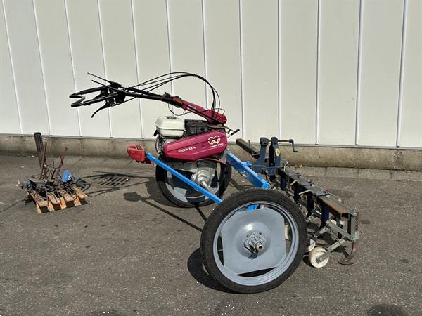 Grote foto honda f560 2 wielige trekker met hak schoffelbalk agrarisch onkruidbestrijding