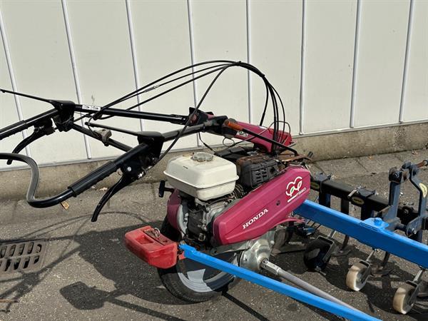 Grote foto honda f560 2 wielige trekker met hak schoffelbalk agrarisch onkruidbestrijding